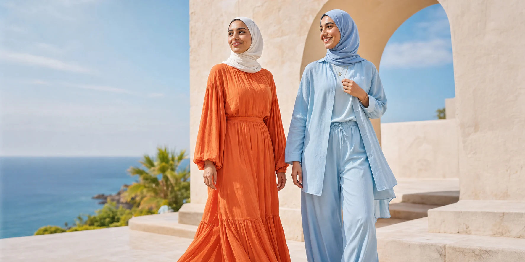 Two women wearing colorful Buskins summer looks by the sea